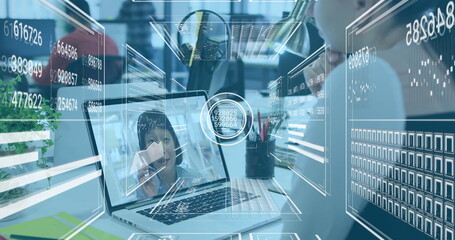 Image overlaying digital interface on laptop during image call in office