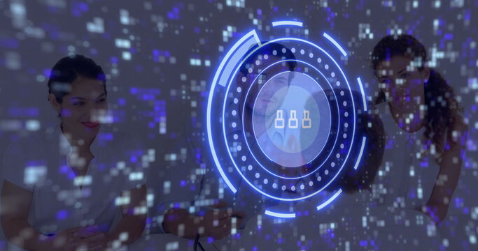 Collaborating IT team examining network nodes in meeting room, with floating holographic display - Powered by Adobe