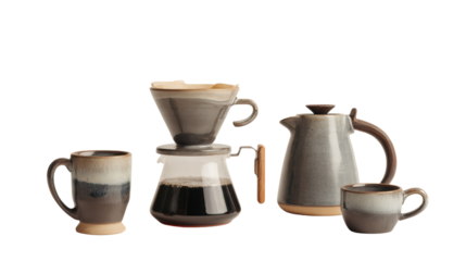 Coffee brewing equipment set on white isolated background, including mugs, chemex, and kettle.