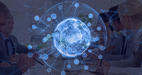 Collaborating colleagues in business attire examining holographic globe display in conference room