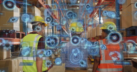 Analyzing digital overlays, workers wearing yellow hardhats and vests viewing shelves in warehouse