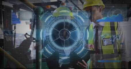 Engineers using holographic interface in plant, with tablet and yellow hard hats and vests