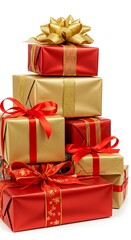 Obraz premium Stack of gold and red christmas presents with ribbons and bows on white