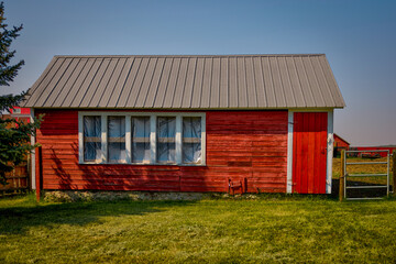 Longview, Alberta - June 8, 2025: Out buildings and landscapes on the Tongue Creek Ranch at sunset

