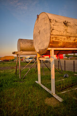 Longview, Alberta - June 8, 2025: Out buildings and landscapes on the Tongue Creek Ranch at sunset
