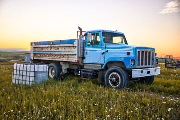 Longview, Alberta - June 8, 2025: Out buildings and landscapes on the Tongue Creek Ranch at sunset

