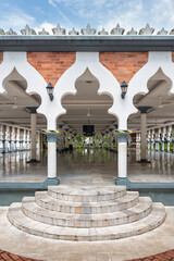 The grandeur of Sultan Abdul Samad Jamek Mosque in Kuala Lumpur, Malaysia during a tranquil day. The intricate architecture draws attention, highlighting its cultural significance and beauty