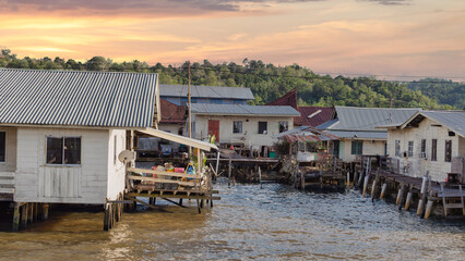 Sunset over the traditional stilt houses of Kampong Ayer, the historic water village on the Brunei River. Bandar Seri Begawan, Brunei