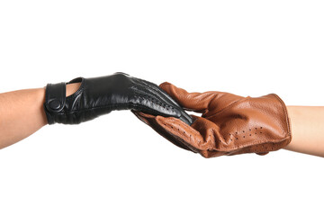 Women in leather gloves shaking hands on white background, closeup