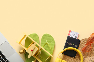 Composition with beach accessories, passport, ticket and toy plane on color background