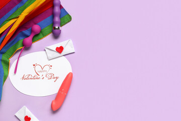 Sex toys with rainbow LGBT flag, festive postcard and decor on lilac background. Valentine's Day...