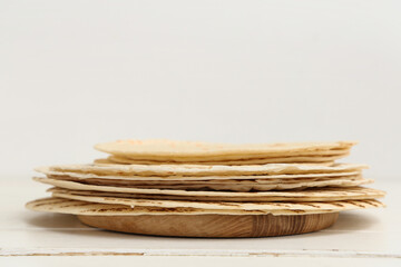 Stack of tasty lavash on white background, closeup