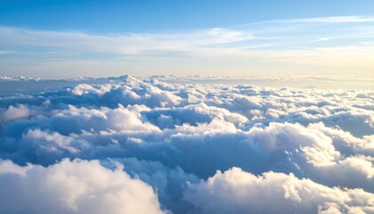Breathtaking airplane view of sky with dramatic clouds and sun
