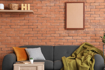 Loft style interior of living room with comfortable sofa
