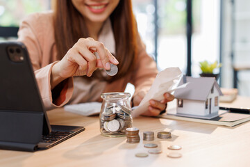 Hand plans home refinance. Pressing calculators, House model, buy or rent, calculators on desk....
