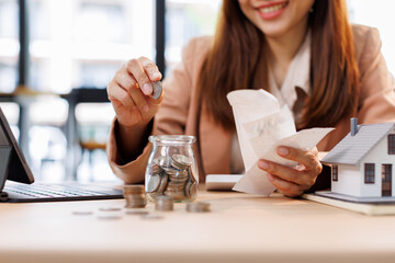 Hand plans home refinance. Pressing calculators, House model, buy or rent, calculators on desk....