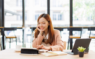 Young busy professional asian business woman company executive or entrepreneur using digital tablet...