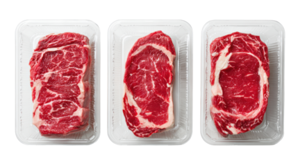 Three cuts of fresh beef steak in clear plastic trays, ideal for culinary and grocery presentations.