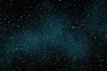 Fototapeta premium Starry night sky with scattered stars and faint blue nebula in deep outer space