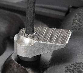 Final step in installing a larger magazine release