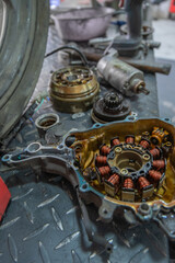 Motorcycle stator repairing in mechanical workshop