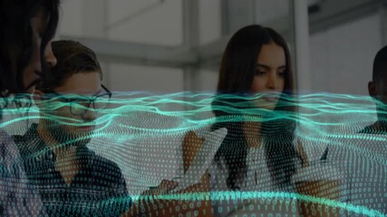 Data-wave graphic appearing over office as data professionals tapping tablets and reviewing charts