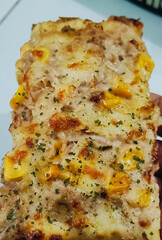 Slice of Square Tuna and Corn Pizza