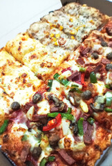 Assorted Pizza Slices with Various Toppings