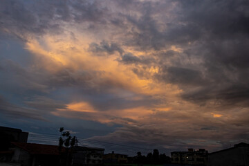 Cloudscape, Colored Clouds at Sunset near the Ocean in a Tropical Climate