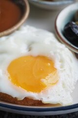 Delicious fried egg served with side dishes for breakfast