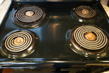 Black electric stove top used for cooking.