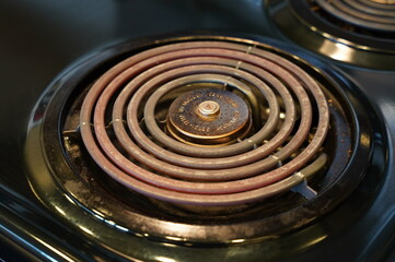 Black electric stove top used for cooking.