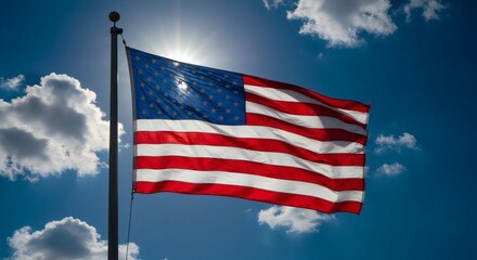 American flag billowing proudly in a bright, sunny sky.