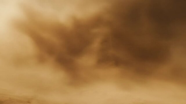 Muted ochre desert landscape obscured by dust