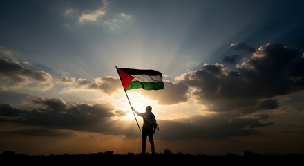 Palestinian flag held high during sunset