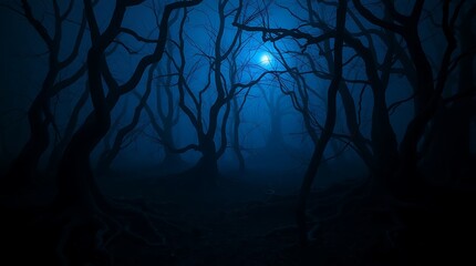 Obraz premium A spooky forest scene with bare trees silhouetted against a blue moonlit and foggy background at night