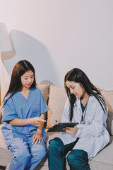 A doctor uses a stethoscope to check the heartbeat of his patient. Patients must undergo a yearly...