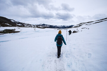 Hiking in the white snows under an overcast sky