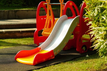 Children's plastic slide toys in the park in the morning