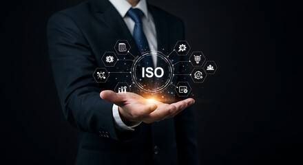 Iso concept presented by a man in a suit with digital icons hovering above his outstretched hand