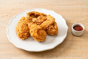 fried chicken with ketchup on plate