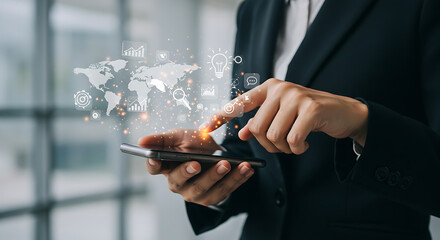 A businesswoman using a smartphone with the world map display, representing global connection and innovation