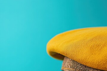 Close-up of a mustard yellow fabric texture.