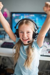 Joyful young girl wearing gaming headset celebrating victory in video game with enthusiastic expression in brightly lit room with computer setup