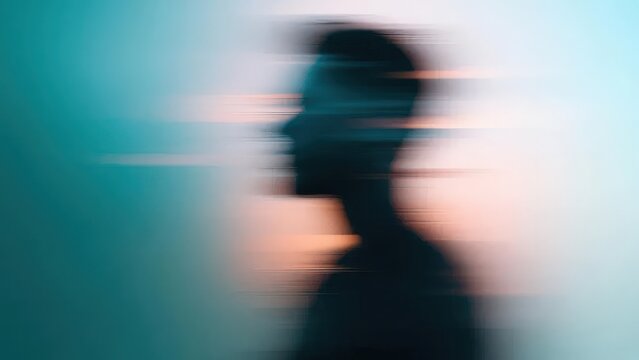Abstract Silhouette of a Person in Motion Against a Colorful Blurred Background Capturing a Sense of Movement and Light