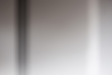 Abstract media of light and shadow on a flat surface.