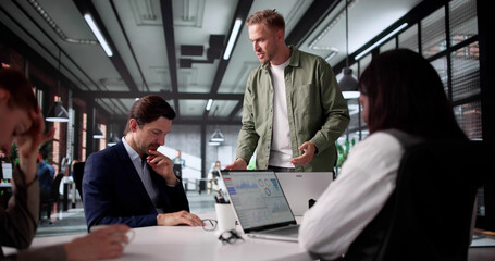 Corporate Boss Arguing With Diverse Team