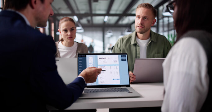 Multiracial Group Collaborating On Electronic Invoice