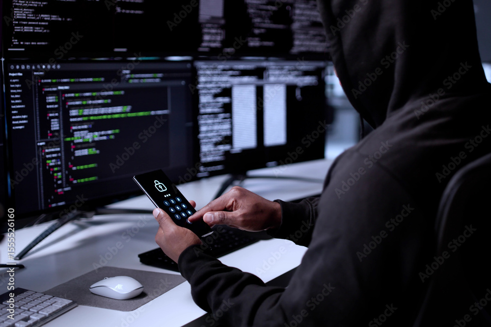 Poster cyber criminal using stolen cellphone to hack data