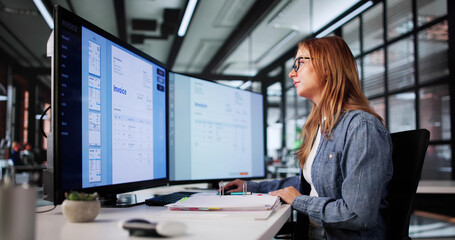 Young Woman Managing Payroll, Auditing Medical Bills